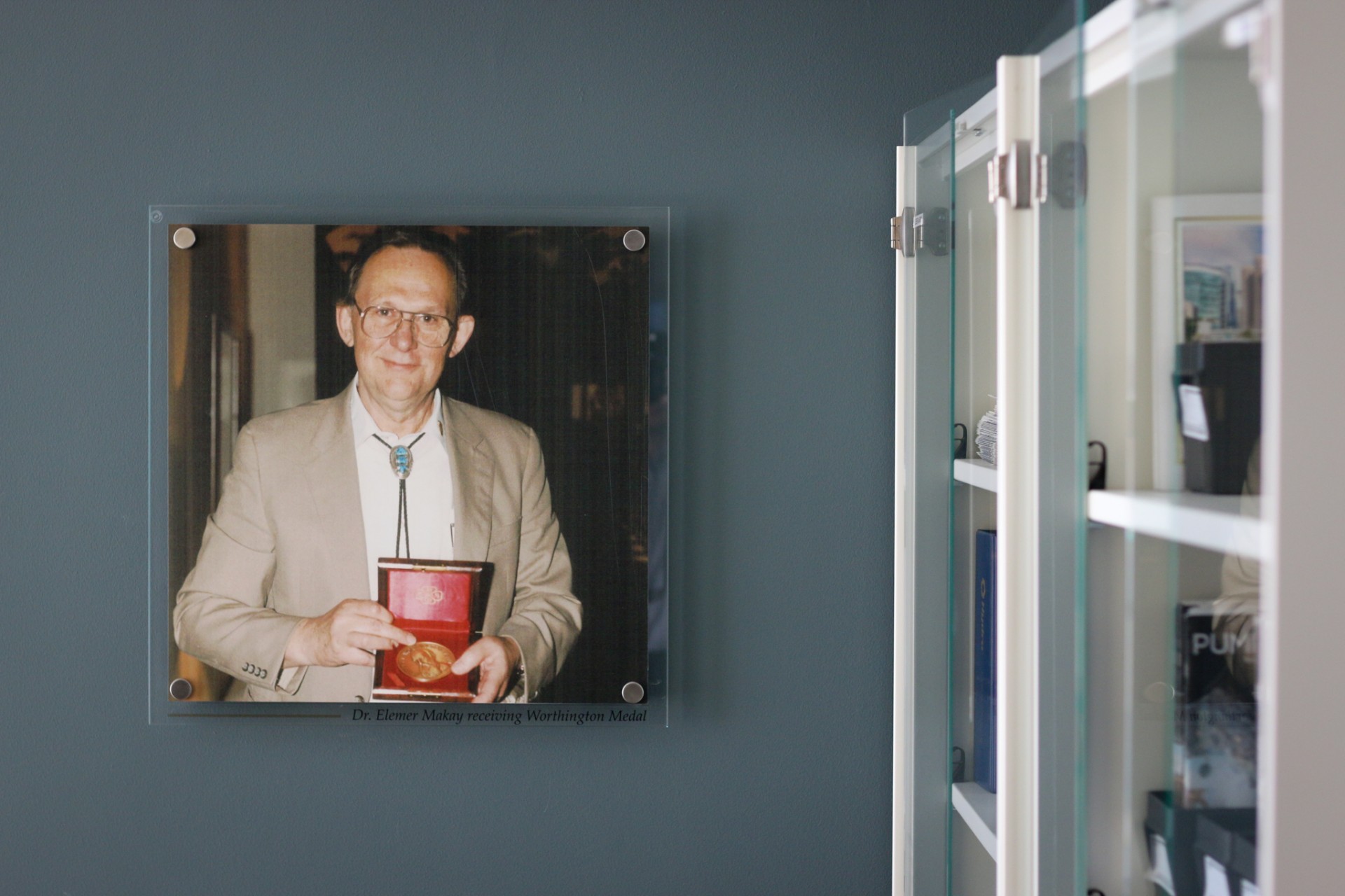 a man sitting in front of a mirror posing for the camera