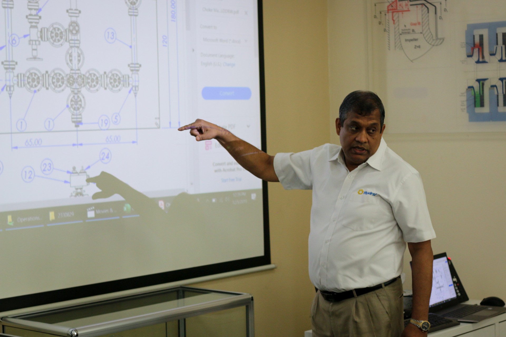 a man standing in front of a television